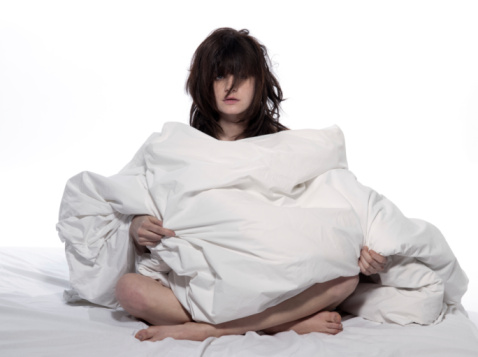 woman exhausted in bed(2) - Are you worrying yourself into insomnia?